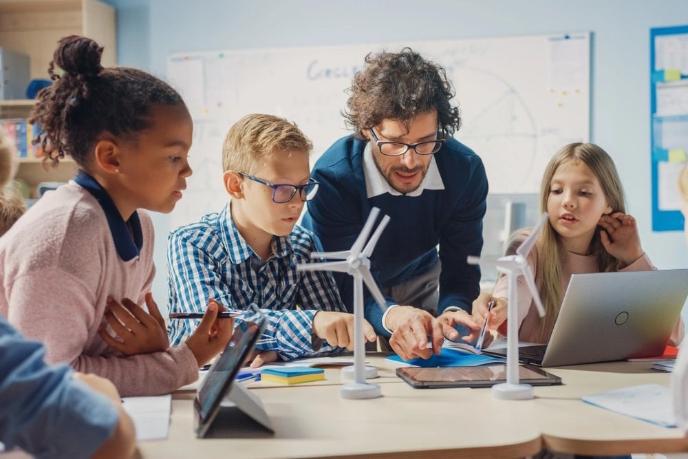 A STEM teacher educating his students in a classroom.