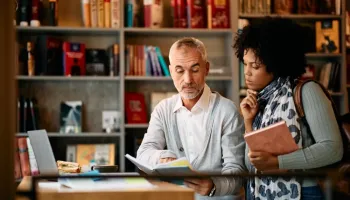 Two professionals engage in active learning strategies for career and professional development