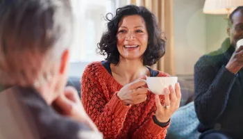 A counsellor smiles warmly during a session, reflecting the rewarding salaries and career of counselling in Australia.