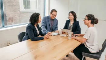 A lawyer reviews legal documents related to practising law in Australia.