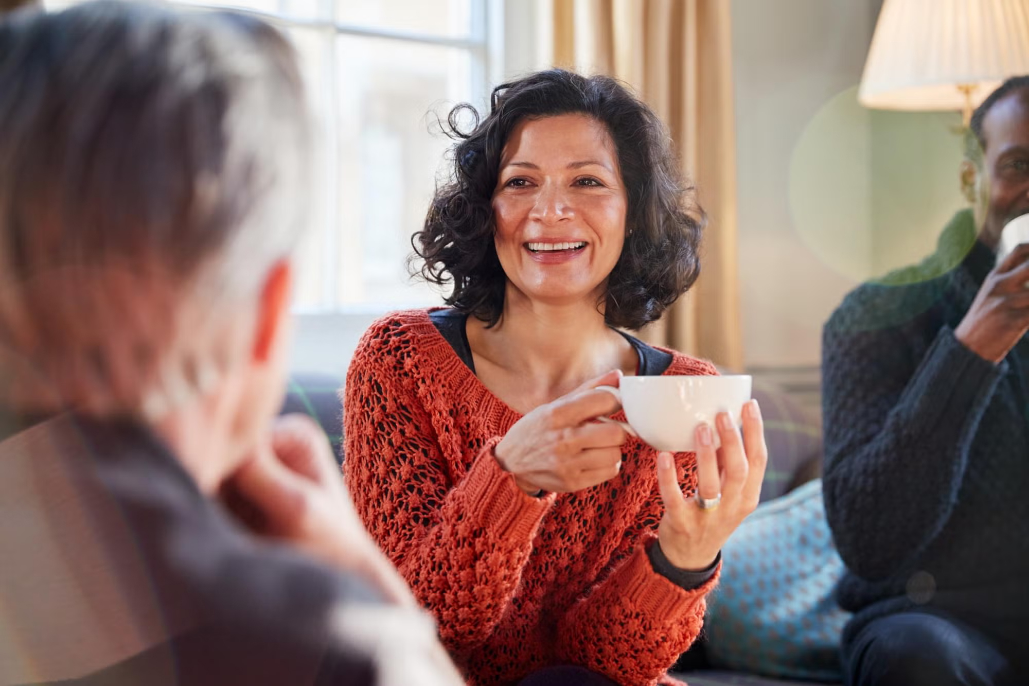A counsellor smiles warmly during a session, reflecting the rewarding salaries and career of counselling in Australia.