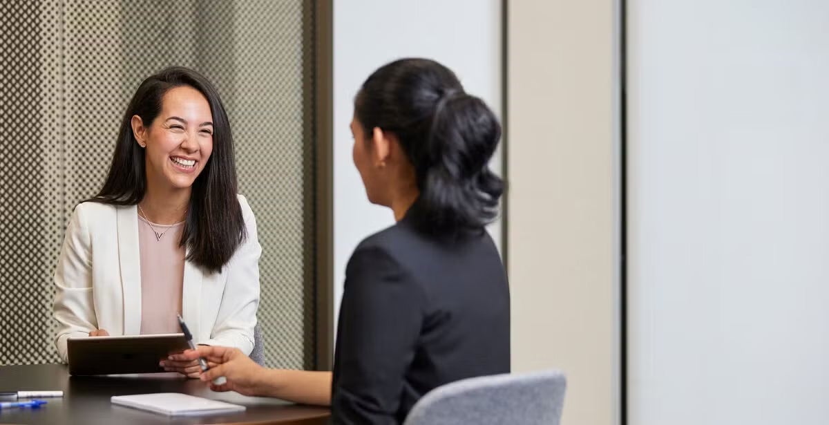 A warm counsellor sits with a client illustrating the journey of becoming a counsellor in Australia